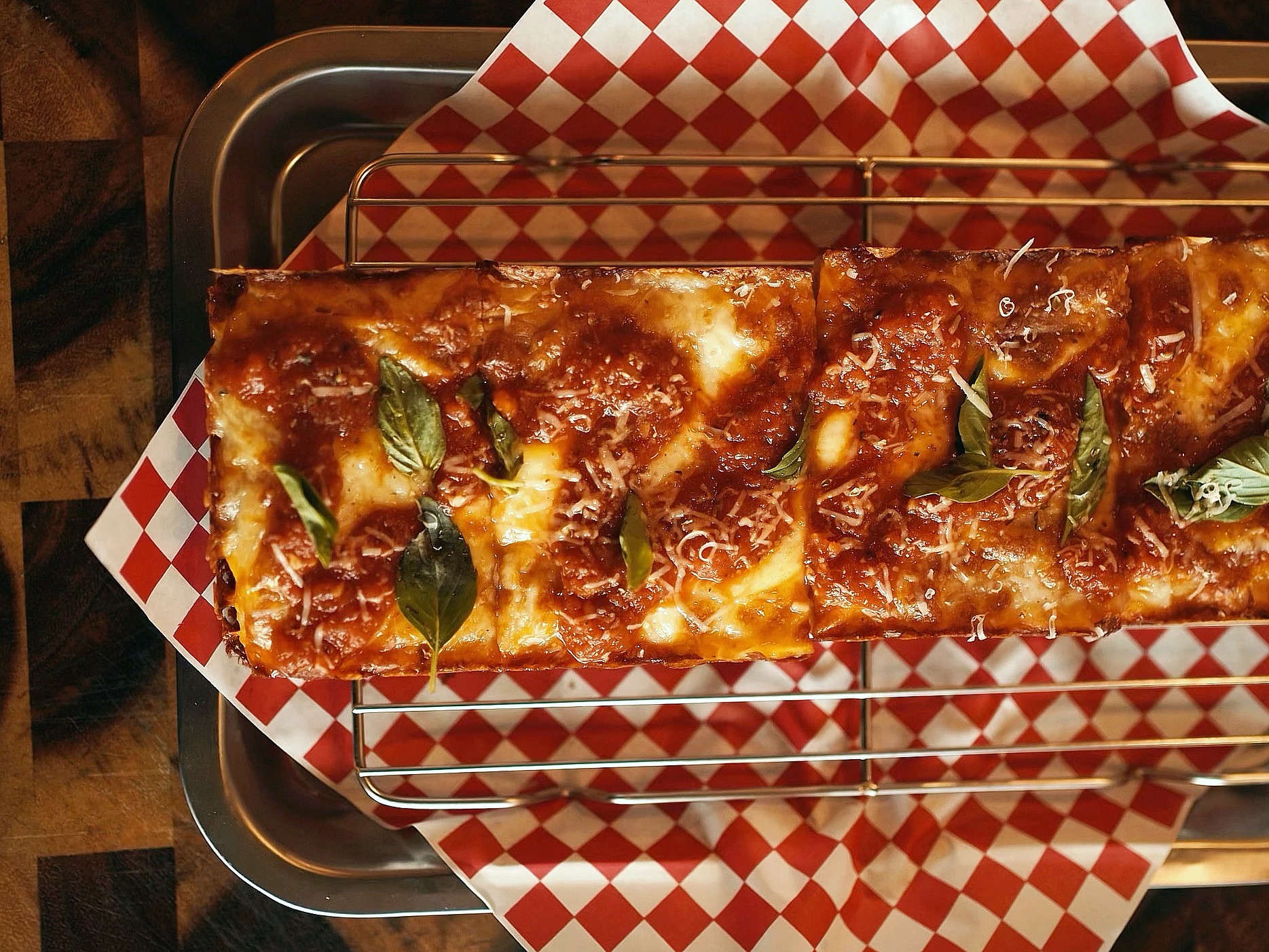 Detroit-style pan pizza with caramelized cheese edges